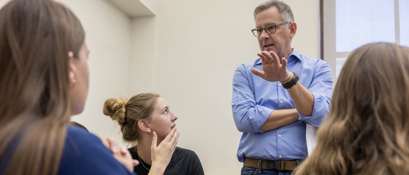 Tyler Priest interacting with students in his History of Oil class