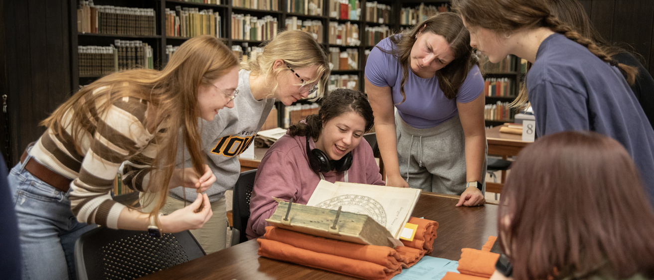 students in special collections with history professor
