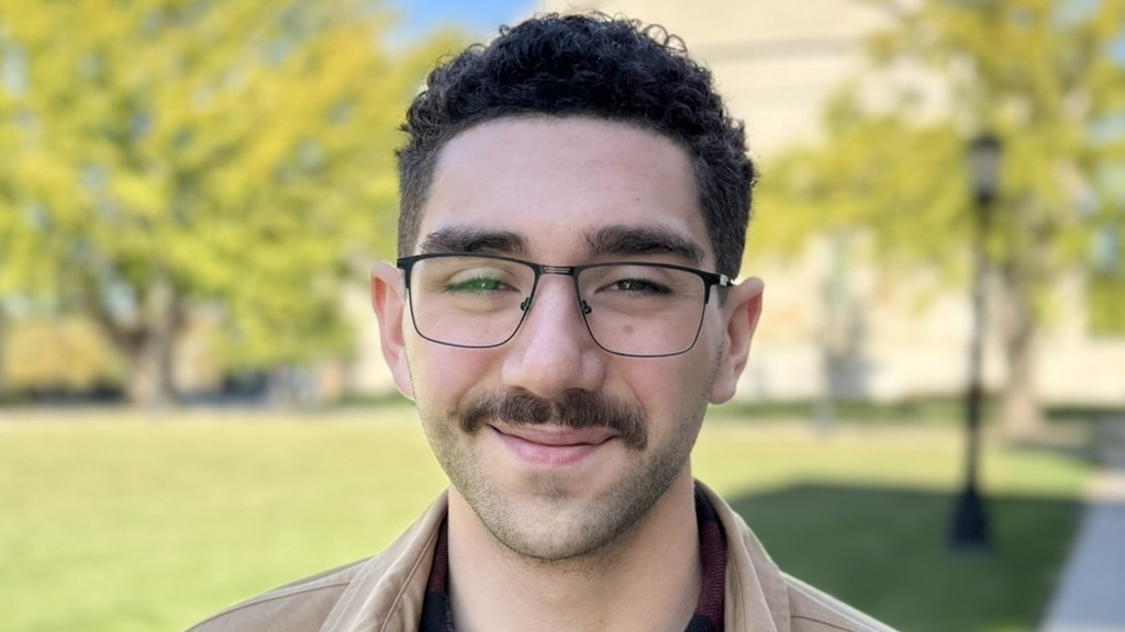 Michael Danos headshot outside Schaeffer Hall